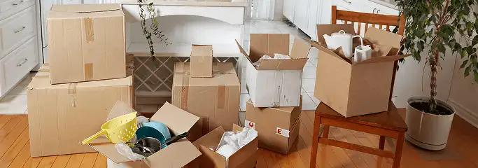 Packed moving boxes and household items in a kitchen before move-out or move-in cleaning, Saint Louis, MO.